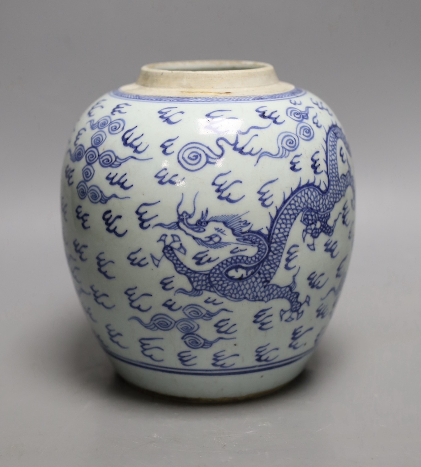 An 18th century Chinese provincial blue and white dragon and phoenix jar, 20cm high